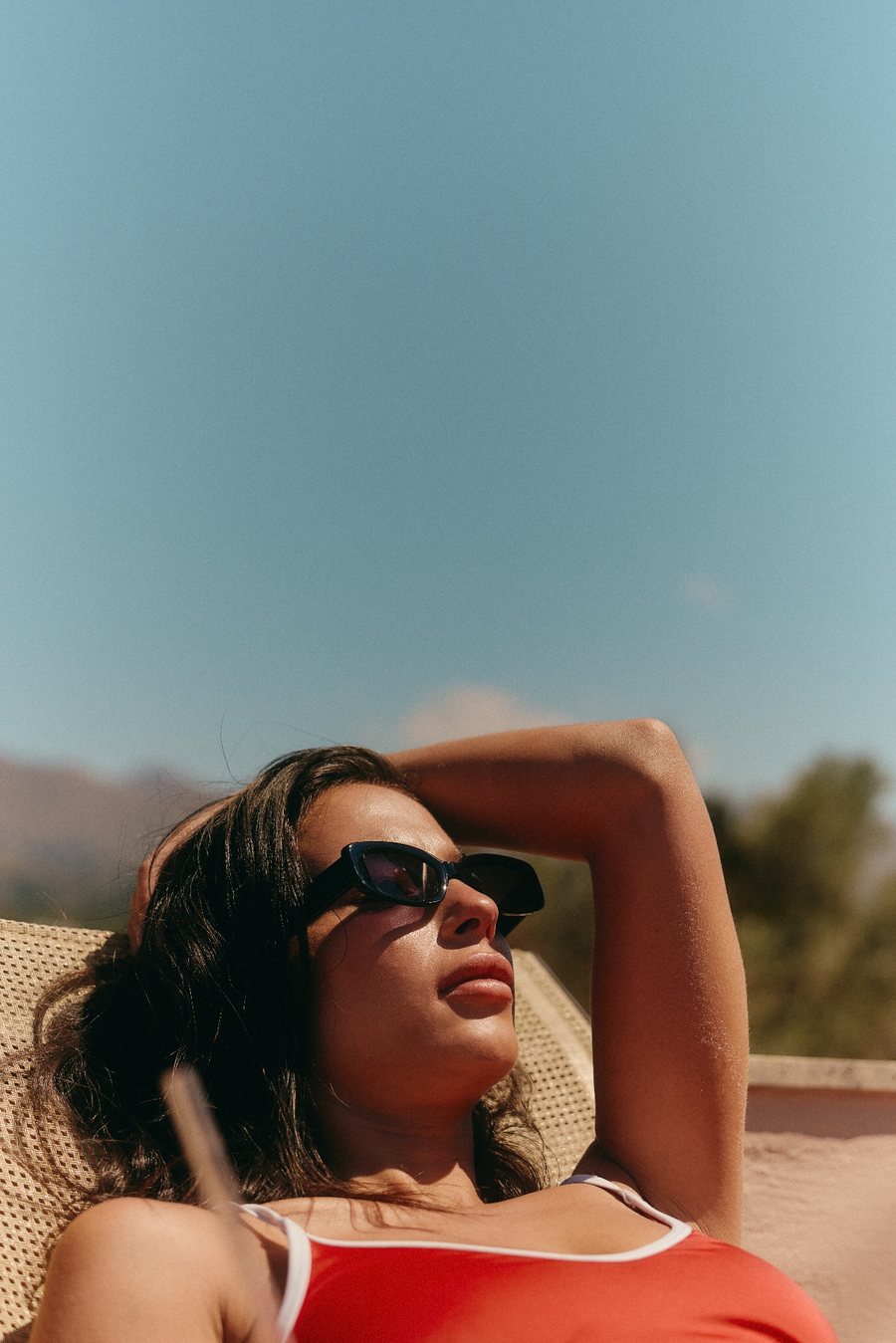 Creator wearing black sunglasses in the sun